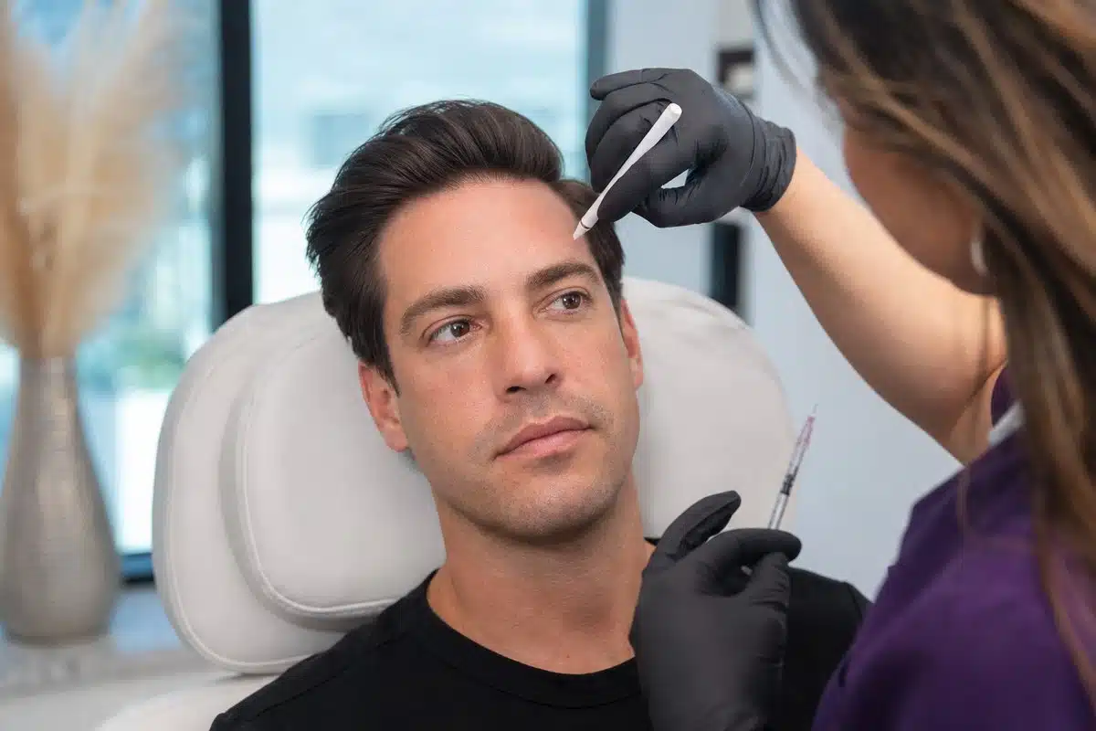 Close-up portrait of a man in his 30s showing a smooth, refreshed forehead after Botox for dynamic wrinkles