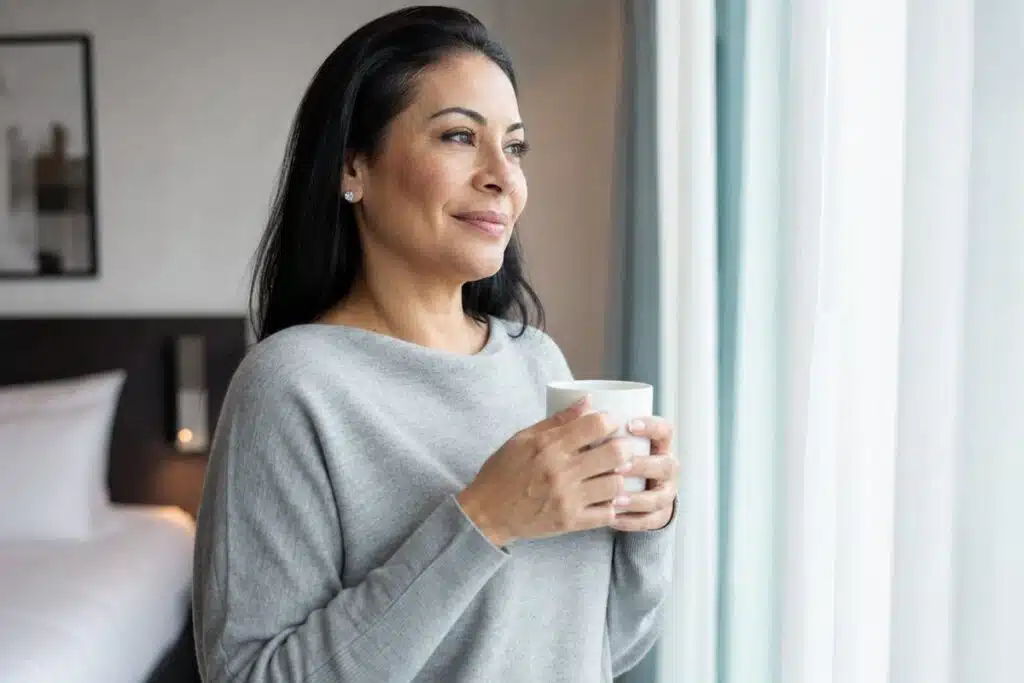 Latina woman in her 40s confident at home after first time filler treatment at Miami Lakes Med Spa