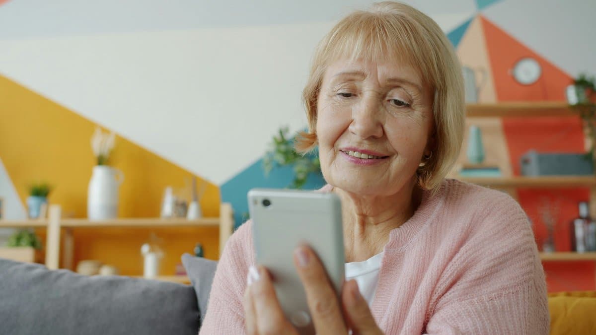 Woman in her 50s taking a selfie showing smooth hair-free legs after laser hair removal in South Florida